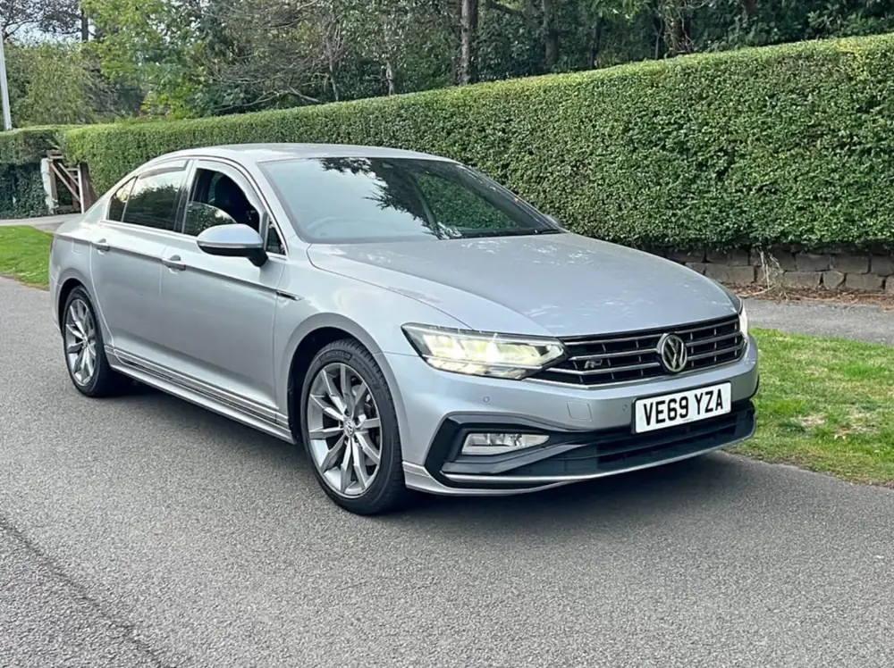 Grey 2020 Volkswagen Passat R-Line saloon parked by a hedge